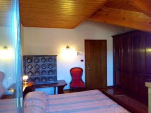 Un pat sau paturi într-o cameră la B&B Casa Bazzanella