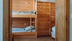 a bunk room with bunk beds in a cabin at Appartement Alpenrauschen in Planneralm