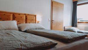 Voodi või voodid majutusasutuse Appartement Alpenrauschen toas