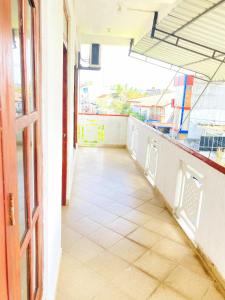 an empty corridor of a building with a door at Mirana Guest in Weligama