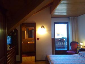 Postel nebo postele na pokoji v ubytování B&B Casa Bazzanella