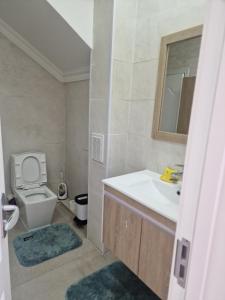 a bathroom with a sink and a toilet at Deegii's house in Ulaanbaatar