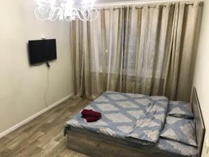 Ένα ή περισσότερα κρεβάτια σε δωμάτιο στο Asaapart Al-Farabi 131/8