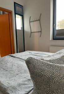 Postel nebo postele na pokoji v ubytování Ferienwohnung Fehmarn am Südstrand