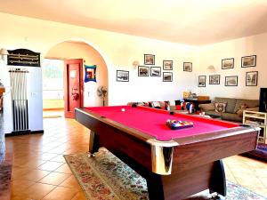 a living room with a pool table in it at Villa dell’Orsa in Cinisi