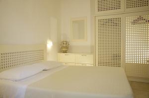 Posteľ alebo postele v izbe v ubytovaní Residence Castello Otranto
