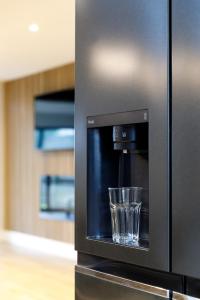 a glass sitting inside of a microwave oven at Free Parking Stylish & modern 4-bedroom home with sea views in Brighton & Hove +45 photos