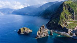 an island in the middle of a large body of water at Quinta' Home in Ribeira da Janela