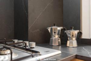 two coffee makers sitting on top of a stove at XX di Mare, Terre Marine in Monterosso al Mare +10 photos