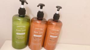 three bottles of soap sitting next to each other at Esperanza 204号室 in Tokyo