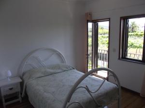 Ένα ή περισσότερα κρεβάτια σε δωμάτιο στο Albergue Constantino AL