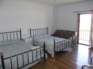 Ένα ή περισσότερα κρεβάτια σε δωμάτιο στο Albergue Constantino AL