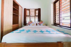 Gulta vai gultas numurā naktsmītnē Flagship Atharvam Resort