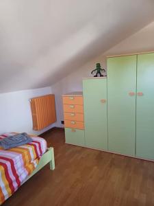 a bedroom with a bed and a dresser at Campo del Gatto in Viterbo