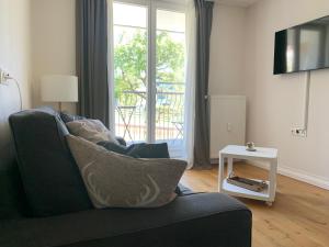 TV a/nebo společenská místnost v ubytování Fliess Apartment