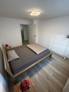 a small bedroom with a bed in a room at Ferienwohnung Laufenburg in Laufenburg