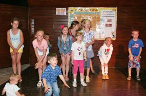 a group of children posing for a picture on a stage at Makronisos Village in Ayia Napa