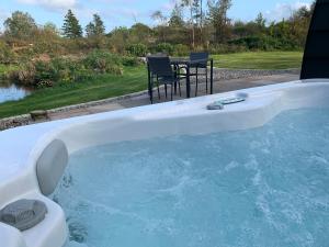 The swimming pool at or close to Red Squirrel Pod with Hot Tub