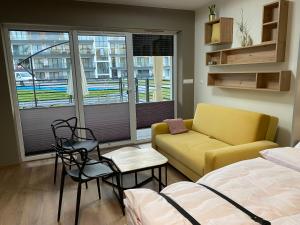 Posezení v ubytování Lagomar Lux Apartamenty & Spa + 39 fotografií