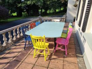 a table and chairs sitting on a patio at Gap Retreat in Carrickmore