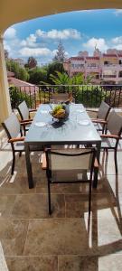 a table with a bowl of bananas on it at Casa Palmu apartment - A peaceful and relaxing oasis in Golf del Sur, Tenerife in San Miguel de Abona