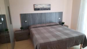 Postel nebo postele na pokoji v ubytování B&B Palatium S.G.