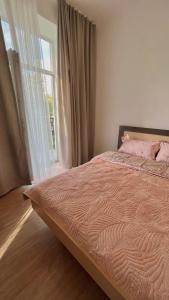 Cama ou camas em um quarto em Ala Too - Square Apartment’s