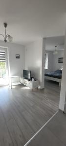 Svetainės erdvė apgyvendinimo įstaigoje Apartament nad jeziorem