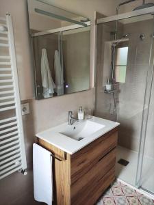 a bathroom with a sink and a shower at La Mirla - Pernús in Colunga