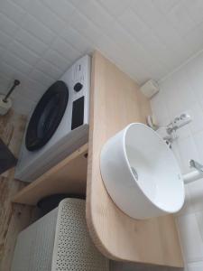 a small bathroom with a sink and a toilet at Aqua Garden in Miercurea-Ciuc