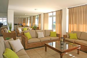 a living room with couches and a coffee table at Makronisos Village in Ayia Napa