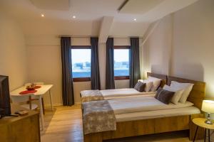 Postel nebo postele na pokoji v ubytování Apartmani Montana Jahorina