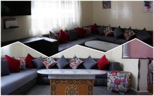 ein Wohnzimmer mit einem Sofa mit roten und schwarzen Kissen in der Unterkunft Hhhhhhhhhh in Asilah
