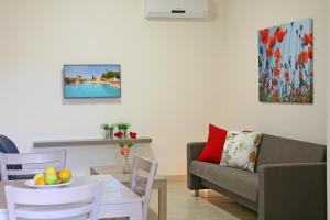 a living room with a couch and a table at Makronisos Village in Ayia Napa