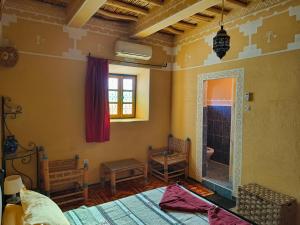 Postel nebo postele na pokoji v ubytování Kasbah Imini Restaurant & Hotel