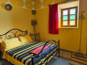 Postel nebo postele na pokoji v ubytování Kasbah Imini Restaurant & Hotel