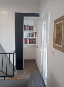 a hallway with a book shelf with books at Lovely flat, city center with free parking in Varaždin