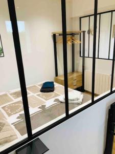 a view of a room through a window at Maisonnette avec terrasse in Argences