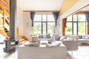 Posezení v ubytování Superbe et chaleureux gîte familial