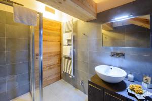 a bathroom with a sink and a shower at Alagna2000 in Alagna Valsesia +122 photos