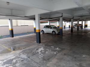 a car parked in an empty parking lot at Apartamento Completo e Aconchegante in Lagoa Santa