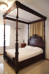 A bed or beds in a room at La Masia
