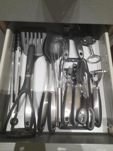 a bunch of utensils in a drawer at Kirkcudbright Holiday Apartments - Apartment D in Kirkcudbright