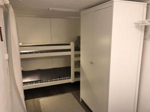 a small white closet with two bunk beds at Rukanpilke in Ruka