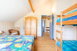 Postel nebo postele na pokoji v ubytování Superbe et chaleureux gîte familial