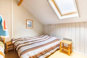 Postel nebo postele na pokoji v ubytování Superbe et chaleureux gîte familial