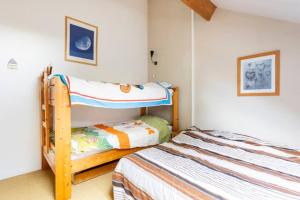 Postel nebo postele na pokoji v ubytování Superbe et chaleureux gîte familial