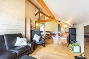 Posezení v ubytování Superbe et chaleureux gîte familial