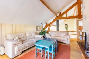 Posezení v ubytování Superbe et chaleureux gîte familial