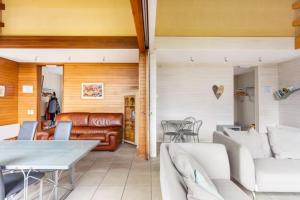 Posezení v ubytování Superbe et chaleureux gîte familial